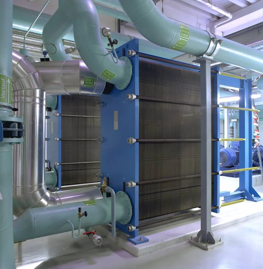 Large plate heat exchanger connected to insulated pipework